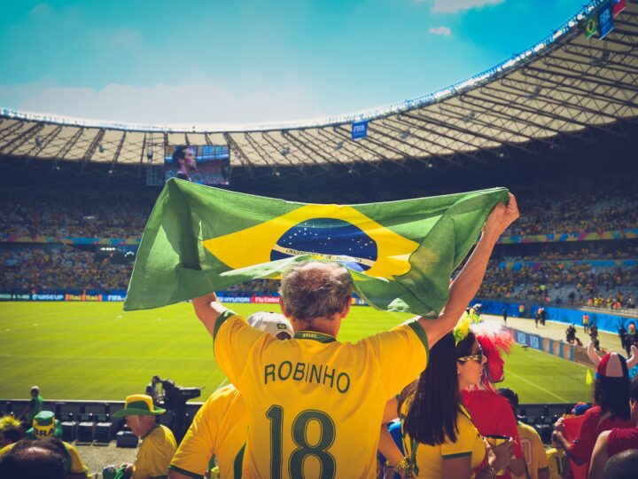 People are cheering for the Brazilian team